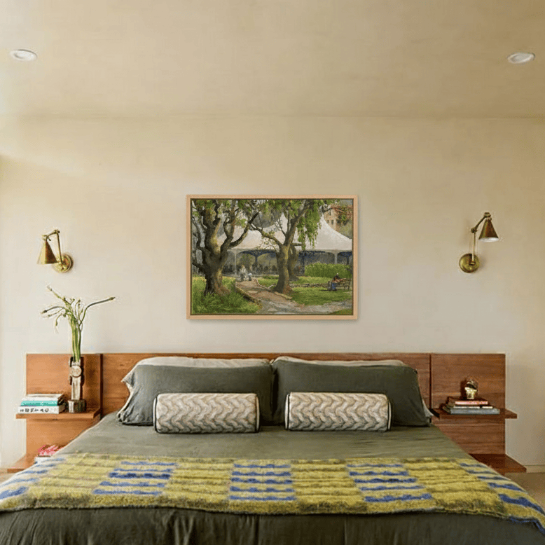 Bedroom with a painting above the bed, two wall sconces, and books on nightstands.