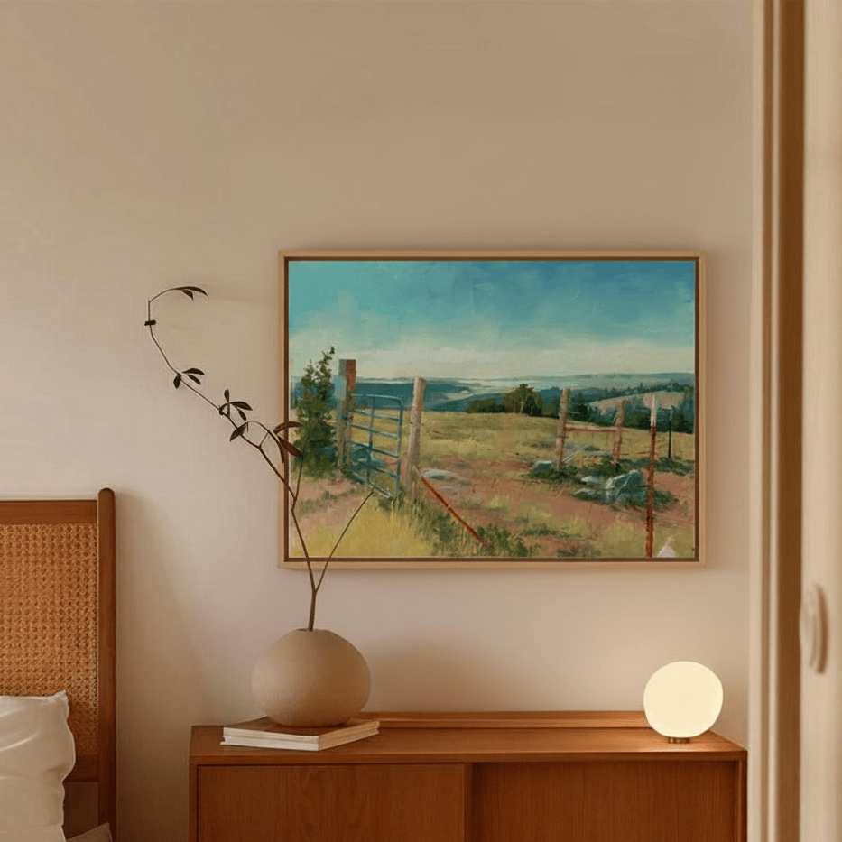 Bedroom with wooden headboard, nightstand, and painting of a landscape by artist Leo Stafsnes.